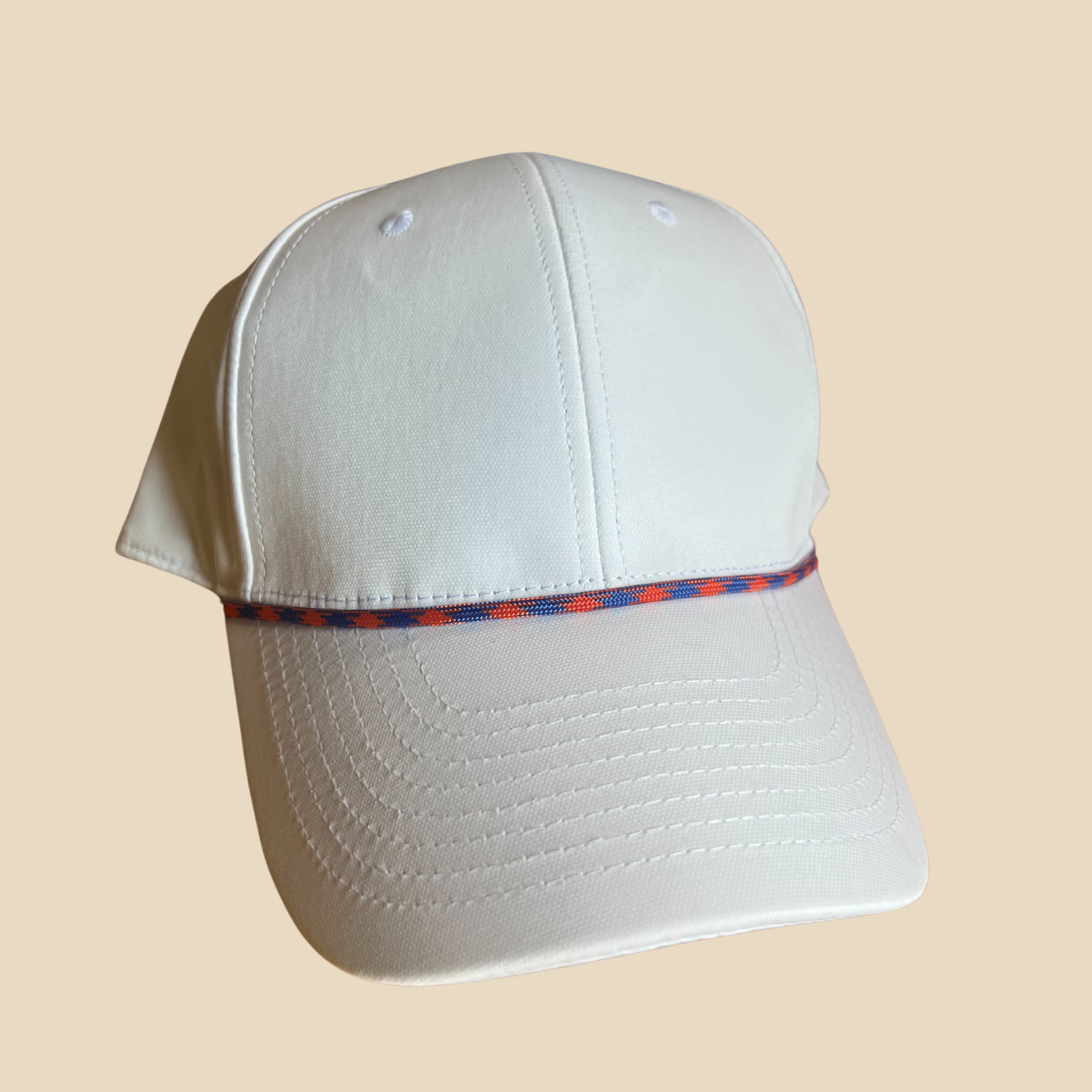 Hat styled with a Blue, Orange attachable hat rope accessory